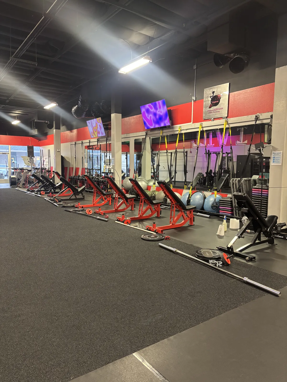 Fitness Explosion main training area with red equipment