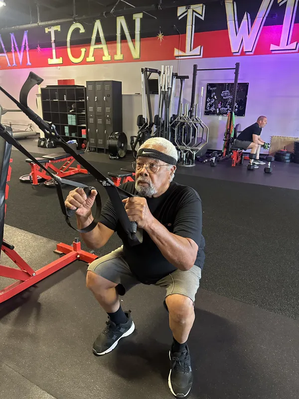 Senior member doing cable exercises — fitness for all ages at FE